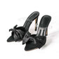 Elegante slingback met hoge hakken en strikje