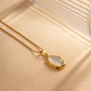 Elegant Vergulde Kattenoog-Opaalketting met Sprankelende Gemma Accenten