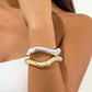 Unieke asymmetrische armband van metalen materiaal voor een stijlvolle uitstraling