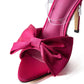 Elegante slingback met hoge hakken en strikje