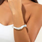 Unieke asymmetrische armband van metalen materiaal voor een stijlvolle uitstraling