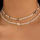Draag de schoonheid van de zee met de elegante schelpenarmband