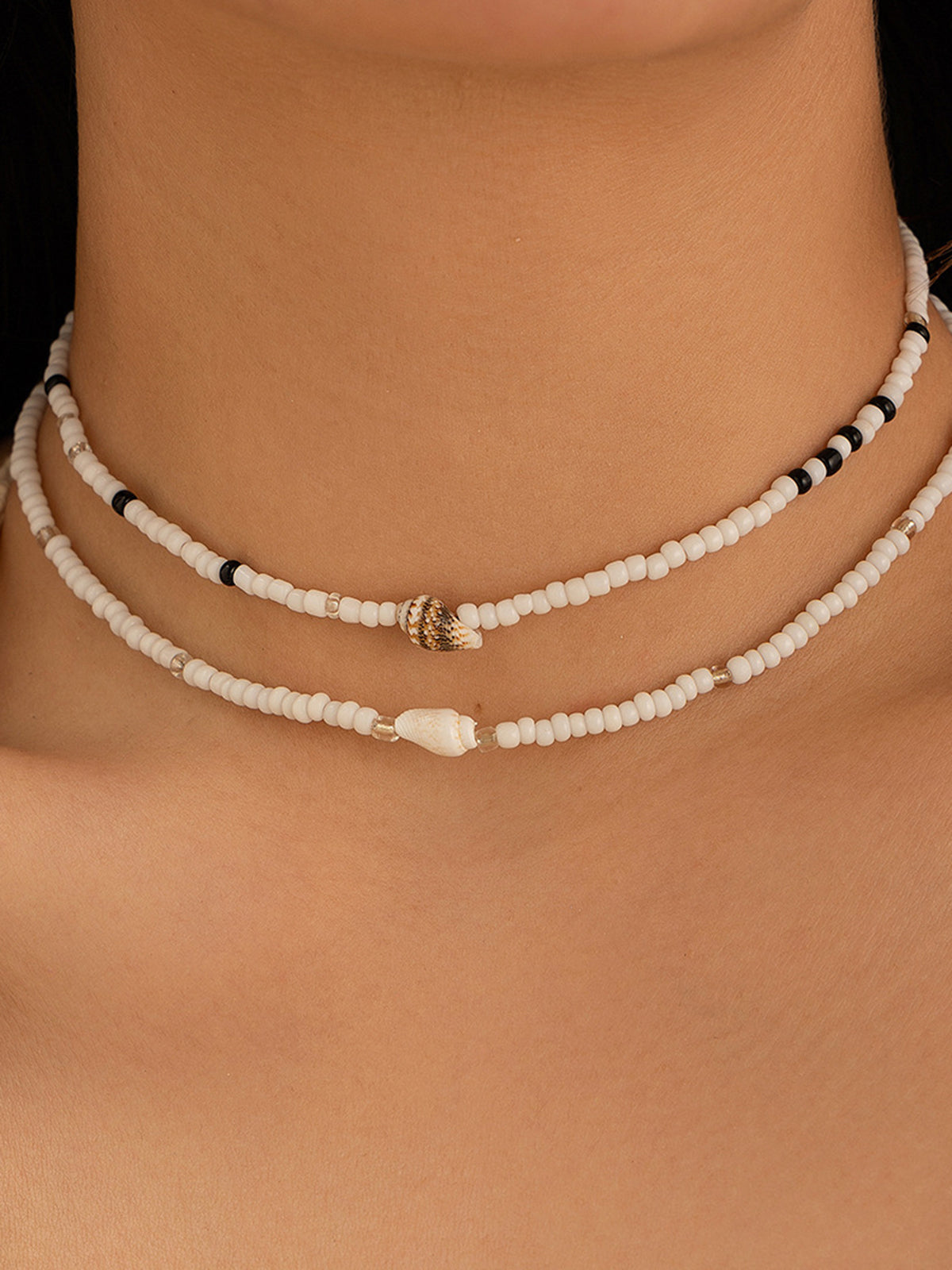 Draag de schoonheid van de zee met de elegante schelpenarmband
