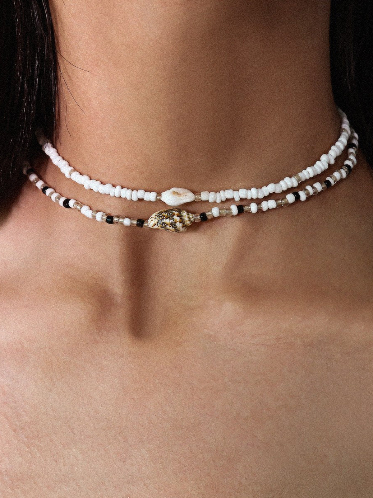 Draag de schoonheid van de zee met de elegante schelpenarmband