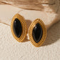 Oorbellen van gouden disku en zwarte onyx – elegante sieraden voor elke gelegenheid
