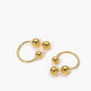 Elegante gouden bol studs en oorbellen voor een stijlvolle uitstraling