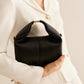 Chique Ronde Tas met Elegante Metalen Accenten