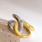 Elegante tweekleurige torsade ring