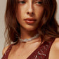 Rondoogketting met torsie en strass voor een glamoureuze en trendy uitstraling