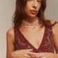 Rondoogketting met torsie en strass voor een glamoureuze en trendy uitstraling