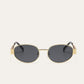 Elegante ovale zonnebril met gouden accenten