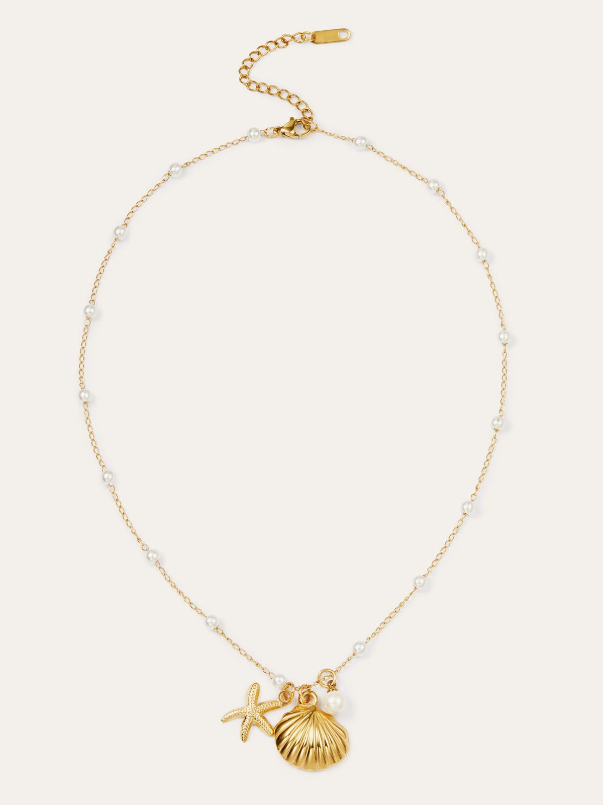 Chique gouden schelp- en zeesterrenhangers met elegante parels