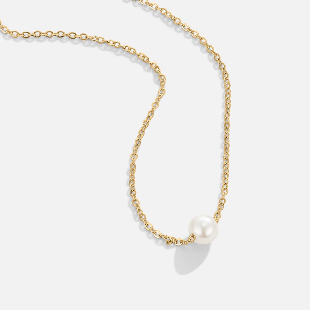 Elegante Solitaire-Halskette mit Goldperle - Klassiker und Stil vereint